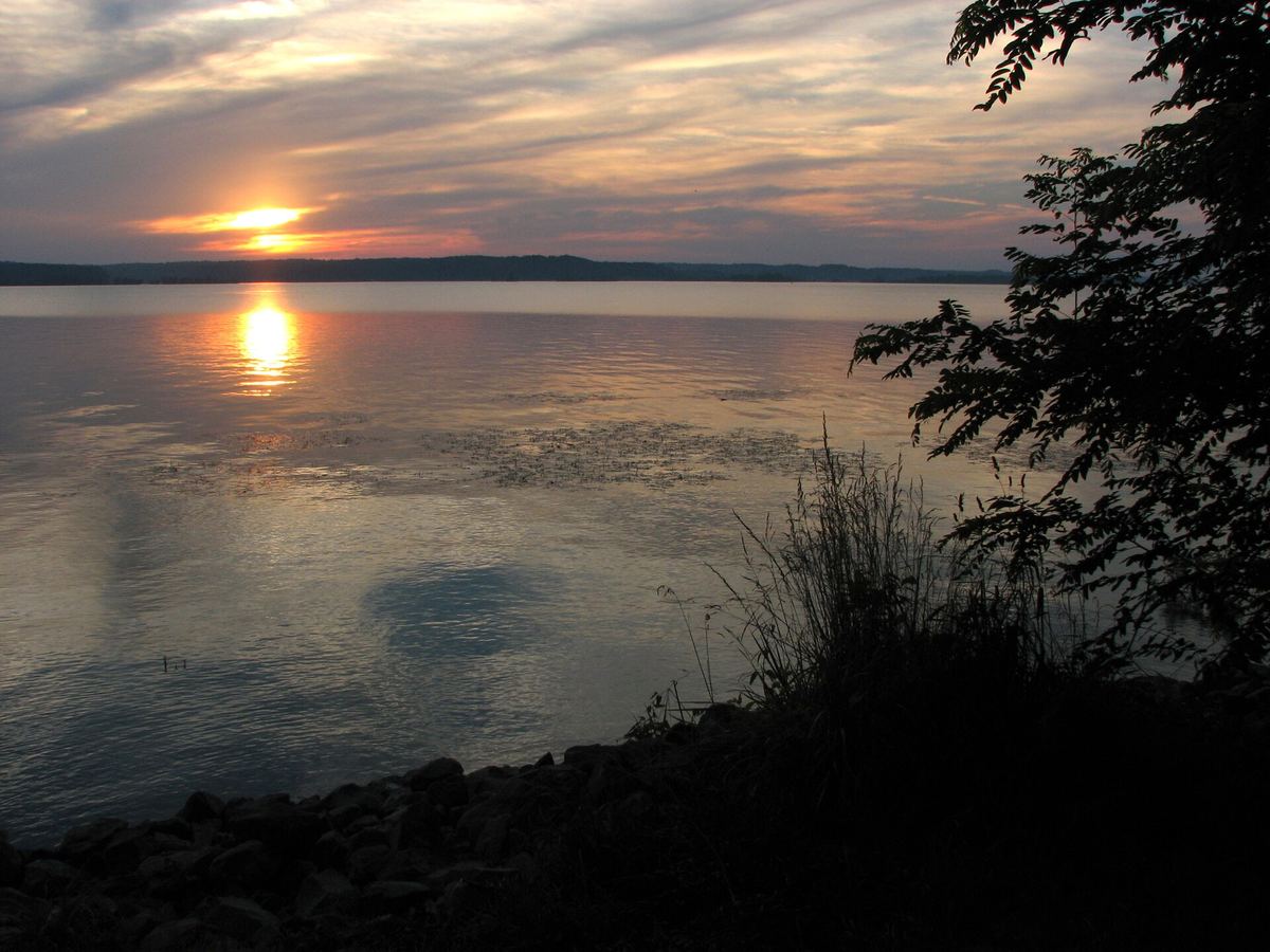 The sun setting over open water at Land Between the Lakes
